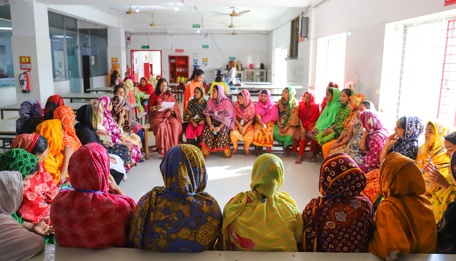 Reemi conducting Menstrual Hygiene Education sessions inside a garment factory to end global period poverty.
